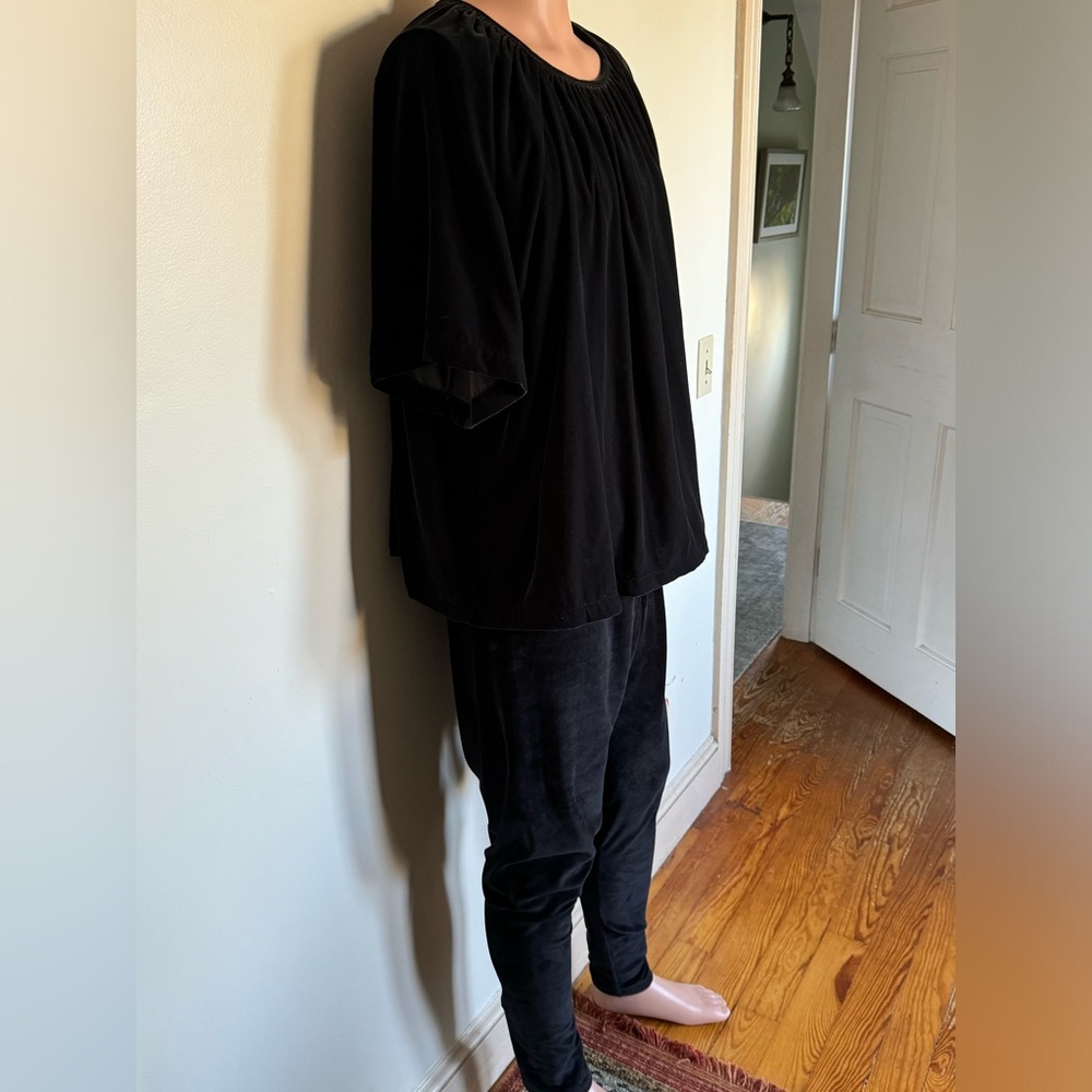 Looks and feels  like velvet. Very comfortable outfit. Size 2X